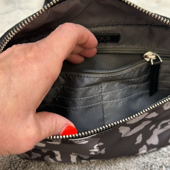 Tumi. New without tags. Endless pockets. - Picture 4 of 10